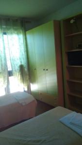 Postel nebo postele na pokoji v ubytování Le Palme