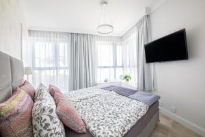 Cama o camas de una habitación en Apartamenty Horyzont Perła