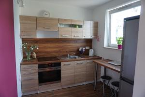 Kuchnia lub aneks kuchenny w obiekcie Apartament ORANGE Warmia Towers