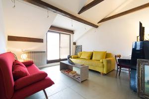 a living room with two couches and a tv at Old Town Apartment in Sarajevo