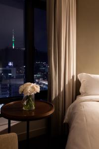 Rúm í herbergi á G2 Hotel Myeongdong