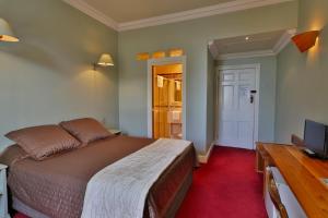 Cama ou camas em um quarto em Astor Private Hotel