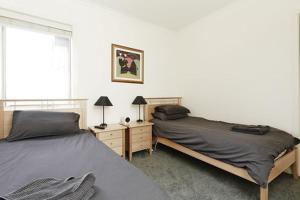 a bedroom with two beds and a window at Reindeer 9 in Mount Buller
