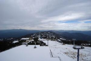 a view from the top of a snow covered mountain at Twin Towers 502A in Mount Buller