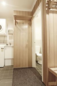 a bathroom with a door leading to a toilet at Valley View 203 in Mount Buller