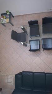 an overhead view of a waiting room with a couch and chairs at Vegan Inn Airport - Adults Only - LATE CHECK IN in Fiumicino