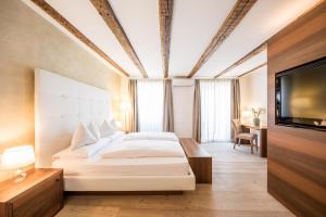 Postel nebo postele na pokoji v ubytování Boutique Hotel Zum Rosenbaum