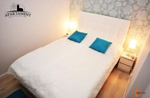 Posteľ alebo postele v izbe v ubytovaní Apartament Pod Kopernikiem
