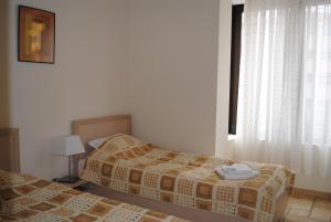 A bed or beds in a room at Kaliakria Resort