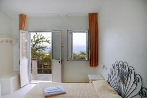 Postel nebo postele na pokoji v ubytování Hotel Paola
