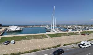 a parking lot with boats in a marina at L'incanto Di Boccadarno in Marina di Pisa