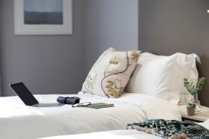 Rúm í herbergi á G2 Hotel Myeongdong