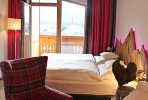 Łóżko lub łóżka w pokoju w obiekcie Hotel Seelos