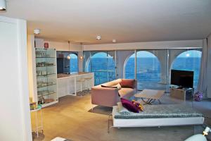 a living room with a view of the ocean at Ocean Loft in Maspalomas