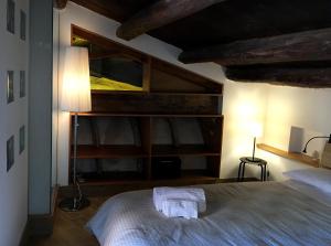 Postel nebo postele na pokoji v ubytování Arias - la suite del Duomo