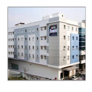 a building with a sign on the side of it at Aditya Hometel in Hyderabad