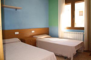Posteľ alebo postele v izbe v ubytovaní Cal Riba