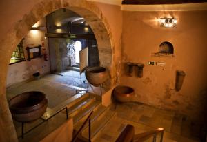 a bathroom with two urinals and two sinks in a building at Hospederia Porta Coeli in Sigüenza