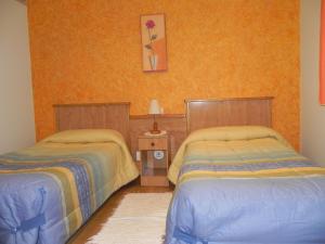 Cama ou camas em um quarto em O Lar de Carmiña