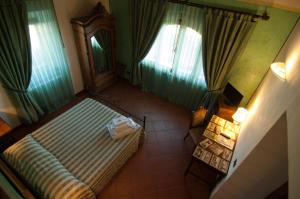 an overhead view of a bedroom with a bed and curtains at Arpaderba B&B in Livorno