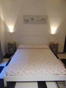 Postel nebo postele na pokoji v ubytování Rocchi Residence