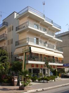 a large building with balconies on top of it at Glaros in Paralia Katerinis