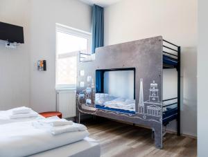 Postel nebo postele na pokoji v ubytování a&o Copenhagen Nørrebro