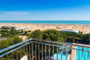 a view of the beach from the balcony of a resort at Hotel Principe in Bibione