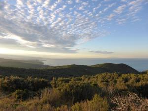 a view from the top of a mountain with a cloudy sky at Arpaderba B&B in Livorno