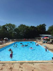a group of people in a large swimming pool at 147 Snowdon Drive, Glan Gwna in Caernarfon
