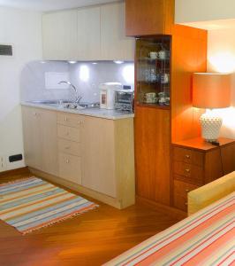 a kitchen with a sink and a counter at Elegante Monolocale Genova in Genova