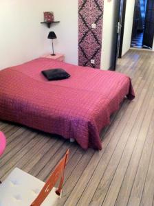Un pat sau paturi într-o cameră la La Cathare