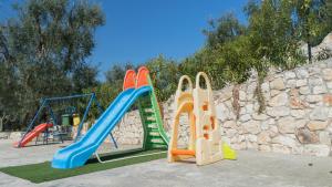 a group of childrens play equipment in a playground at Villa Calma in Vieste