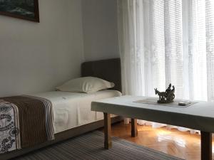 Postel nebo postele na pokoji v ubytování Apartments Pavićević