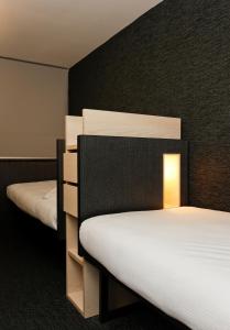 Cama o camas de una habitación en FIAP Paris