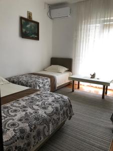 Postel nebo postele na pokoji v ubytování Apartments Pavićević