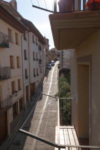 an empty street in a city with buildings at Apartamentos Prades in Morella