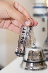 a person is holding a faucet with their hand at Galley Hotel in Istanbul