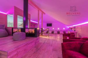 A television and/or entertainment centre at Belvenu Boutique Hotel