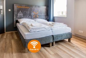 Postel nebo postele na pokoji v ubytování a&o Copenhagen Nørrebro