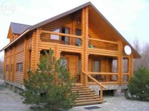 a large log cabin with stairs in front of it at Villa Mango in Vylkove