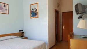 Postel nebo postele na pokoji v ubytování Hotel Firenze