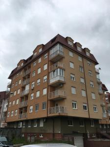 a large building with balconies on the side of it at Studio Apartments Banja Luka in Banja Luka
