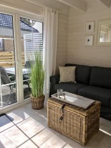 a living room with a couch and a table at 8 Sosen Pobierowo in Pobierowo