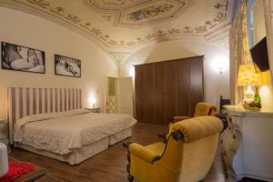 Ένα ή περισσότερα κρεβάτια σε δωμάτιο στο B&B Pantaneto - Palazzo Bulgarini