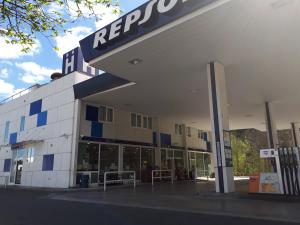 a building with a repsol sign on the side of it at Hotel Beasain in Beasain