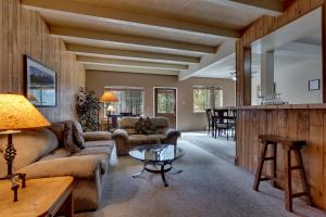 a living room with a couch and a table at Heavenly Valley Townhouses in South Lake Tahoe