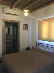 מיטה או מיטות בחדר ב-Xenios Guesthouse