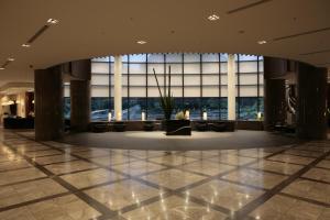 a large lobby with a large window in a building at Cerulean Tower Tokyu Hotel, A Pan Pacific Partner Hotel in Tokyo