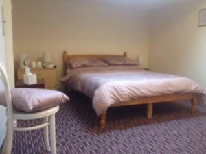 Кровать или кровати в номере Bronte House Hotel